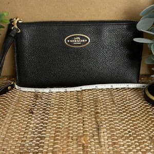 Beautiful Coach black wristlet.